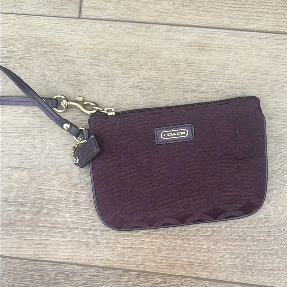 COACH Plum Signature Wristlet with Gold Hardware